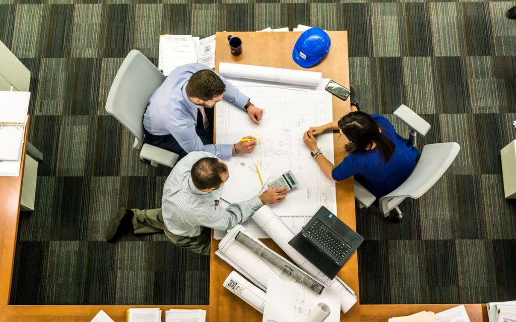construction business people planning around a table