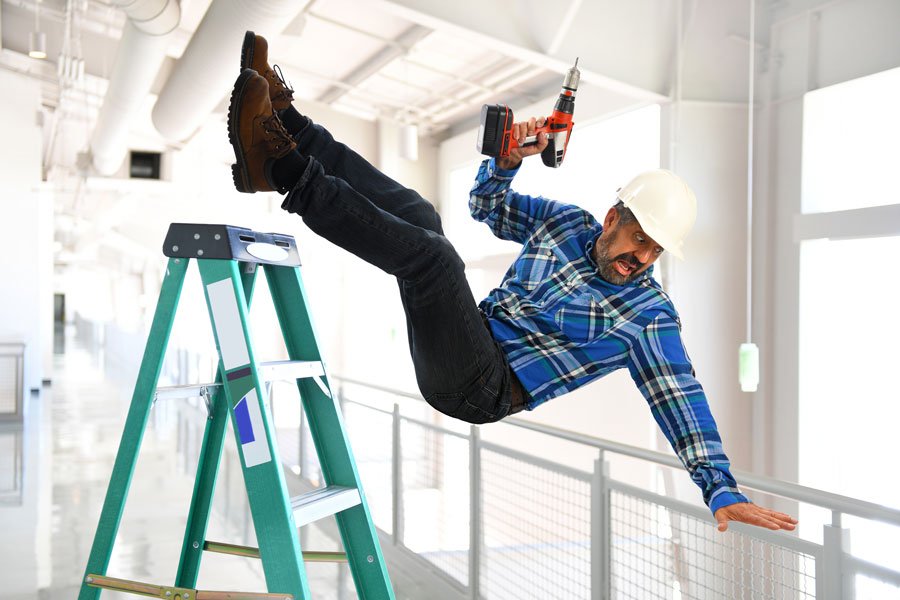 construction worker falling of a ladder with a drill and has liability insurance